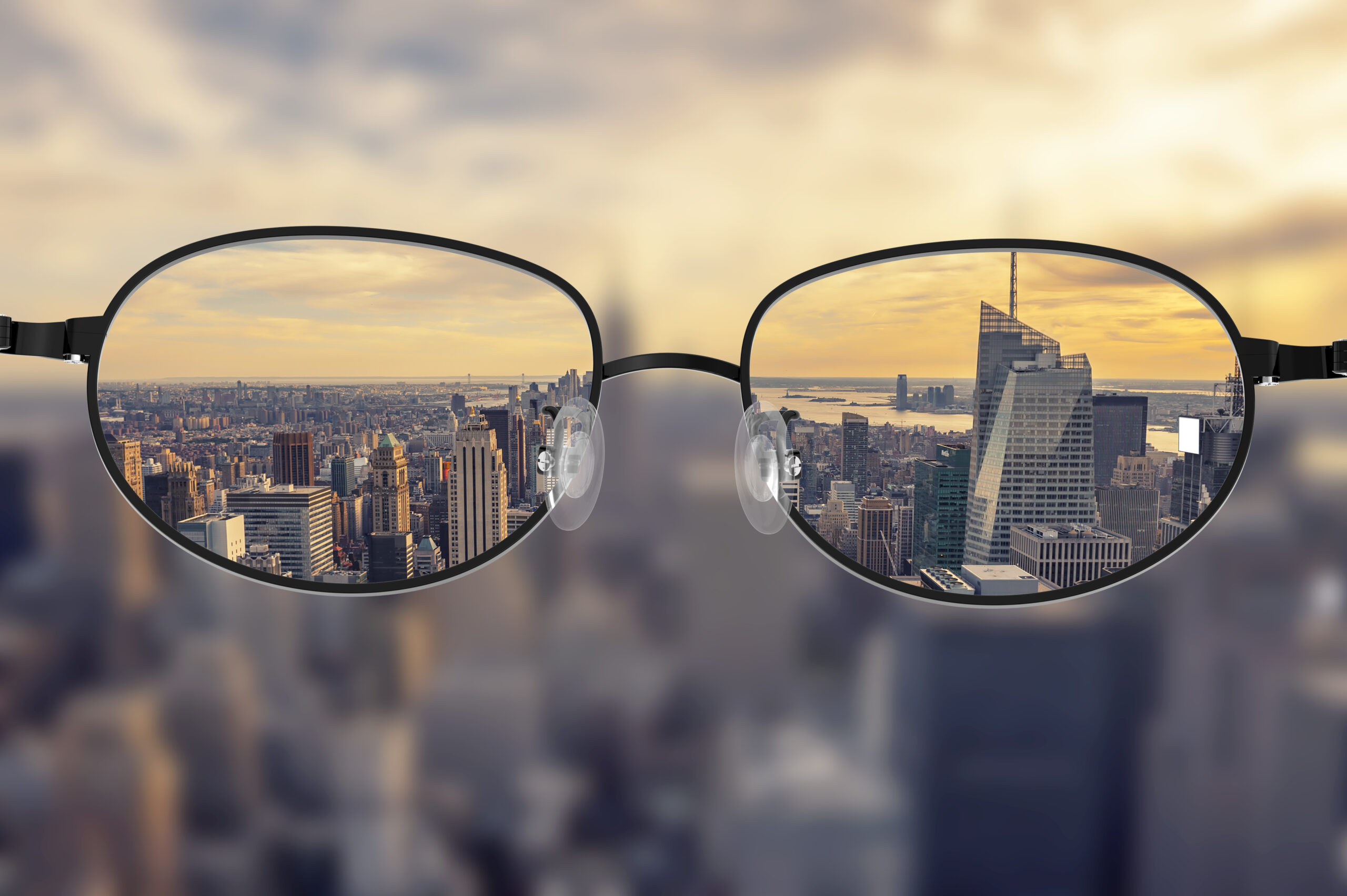 Clear cityscape focused in glasses lenses